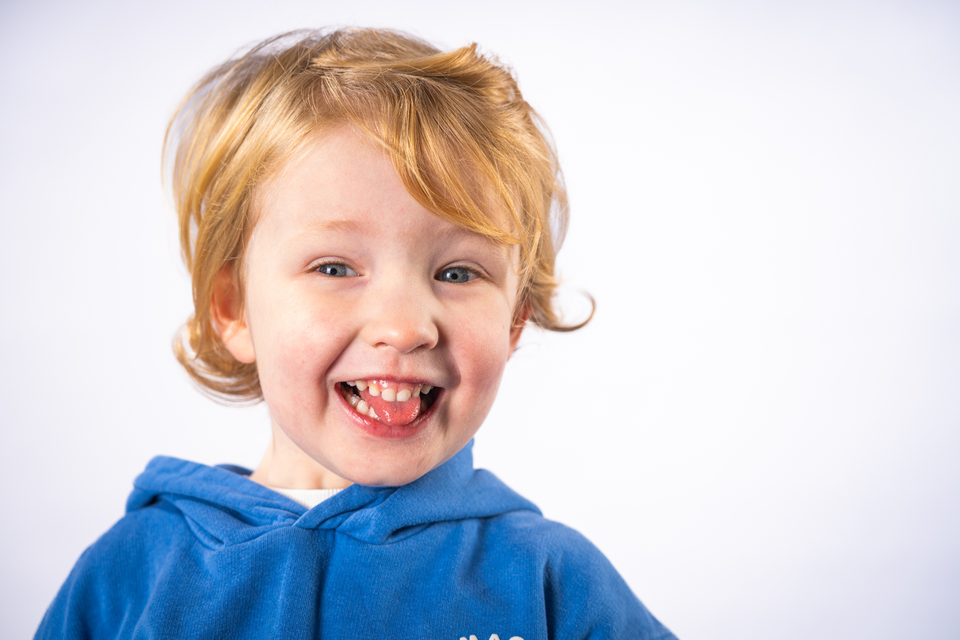 Individual school portrait - young boy in blue hoodie