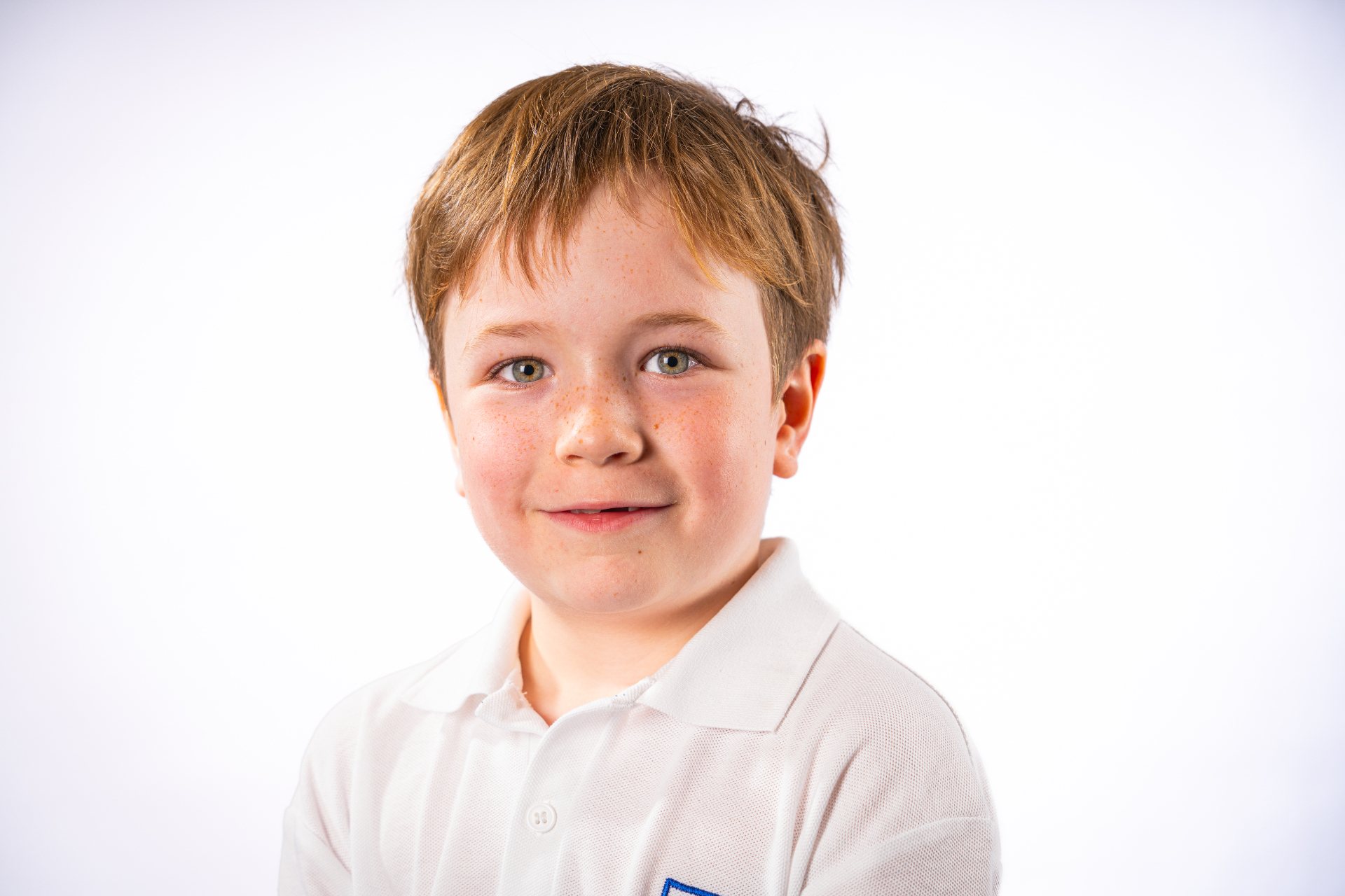 Individual school portrait - boy in white polo shirt