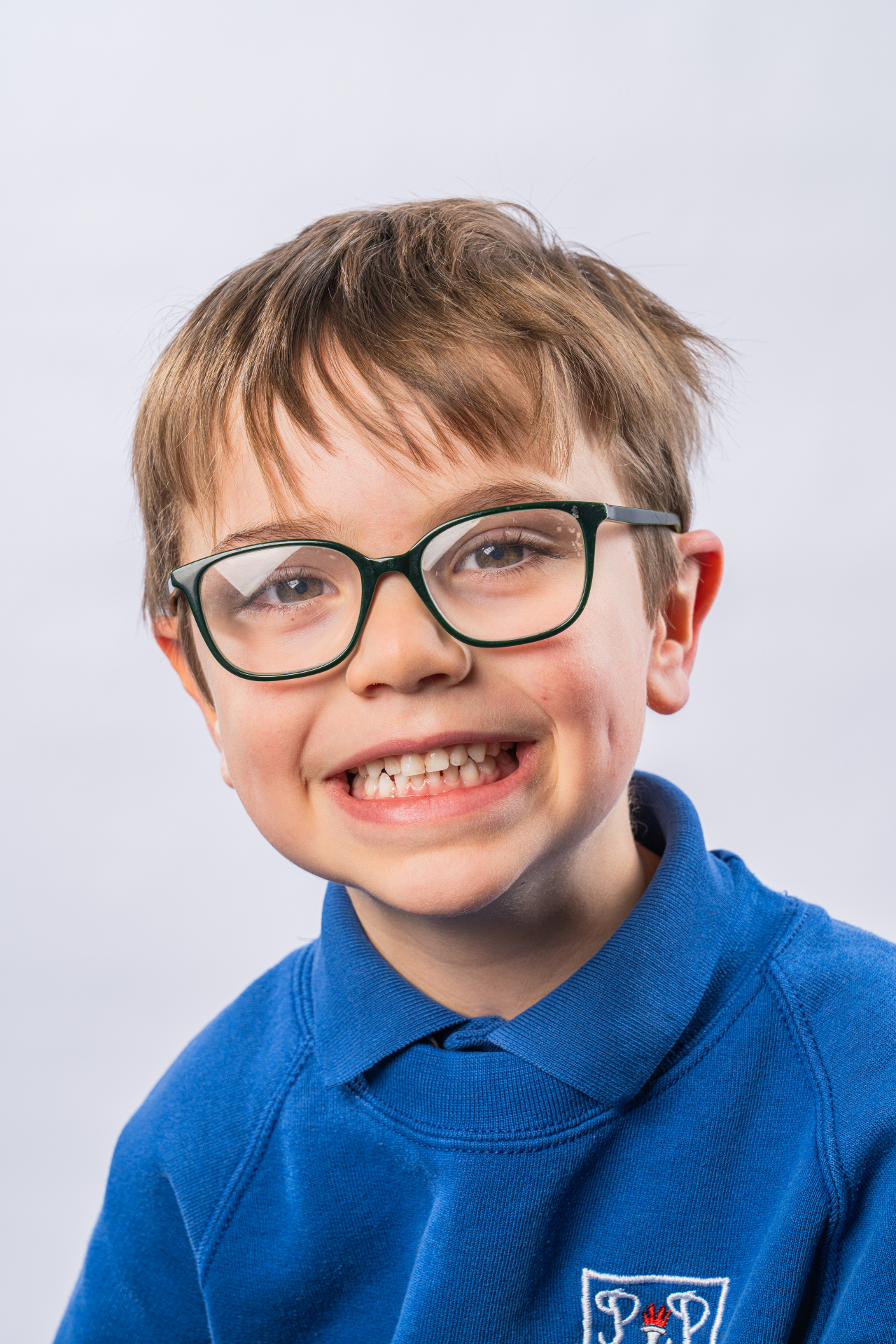 Individual school portrait - boy in navy jumper