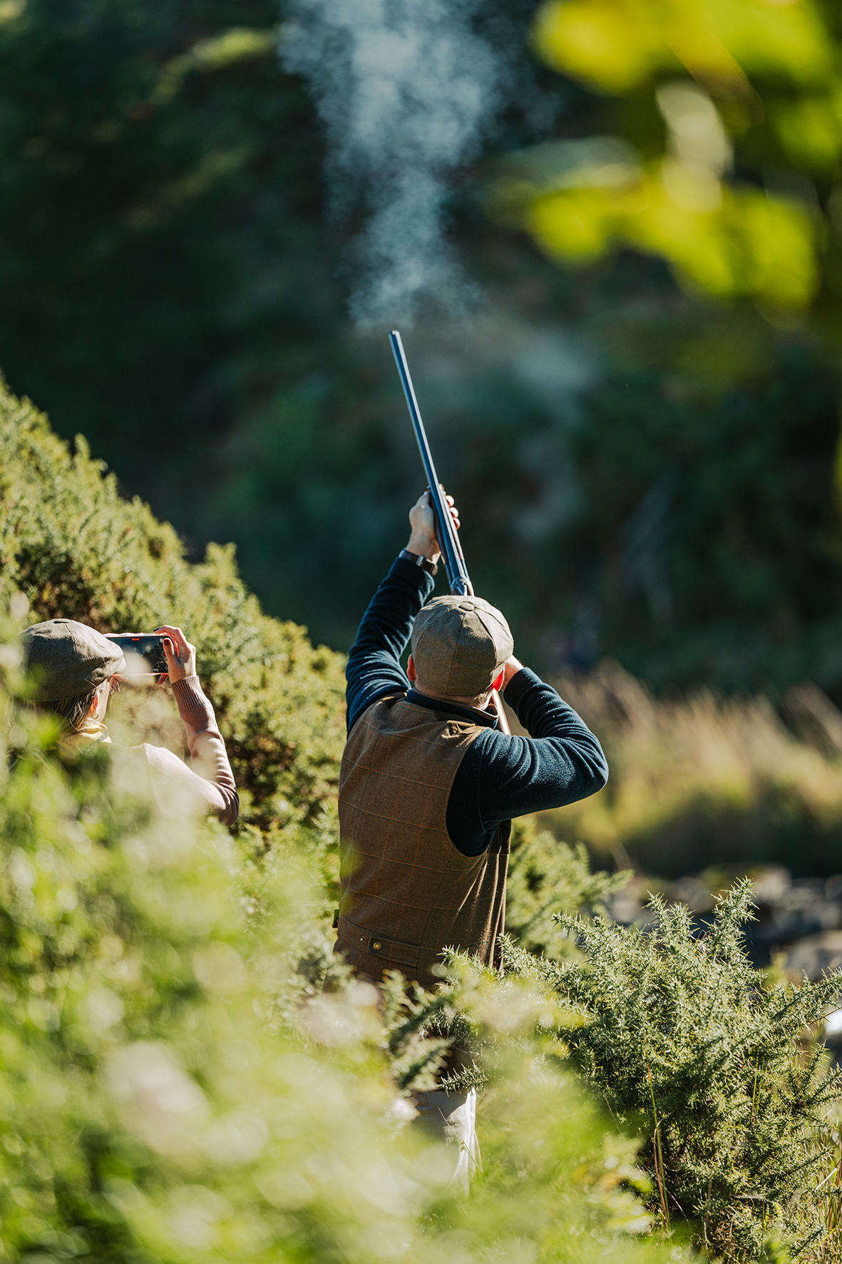 Gundog handler with working dog during shooting party